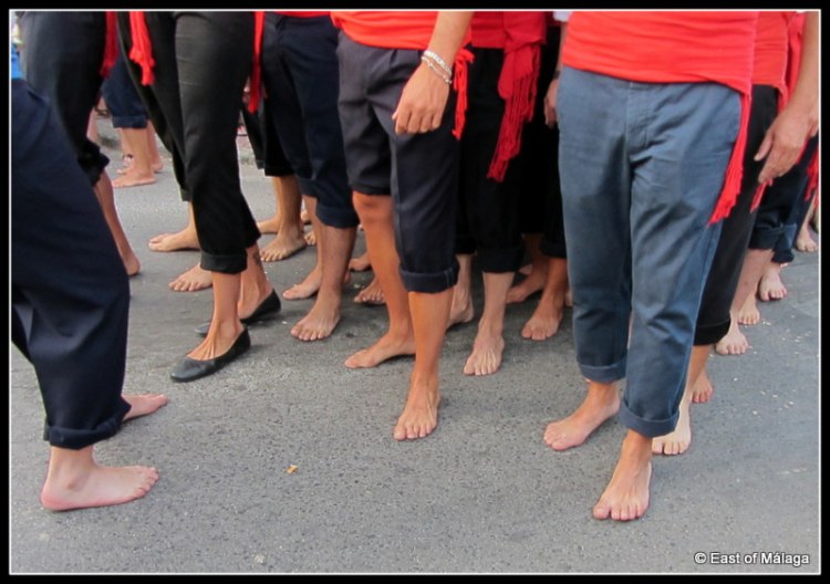 Carrying the statue with bare feet