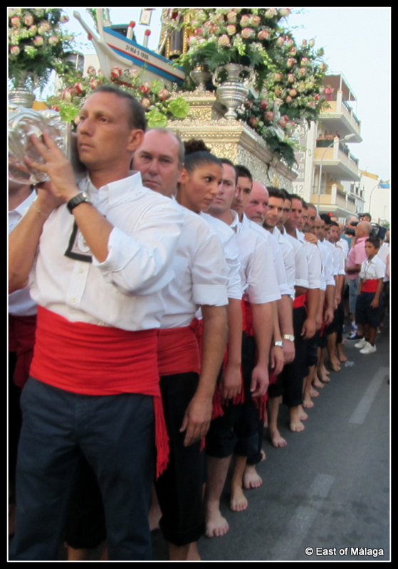 The line of bearers carrying the Virgen del Carmen