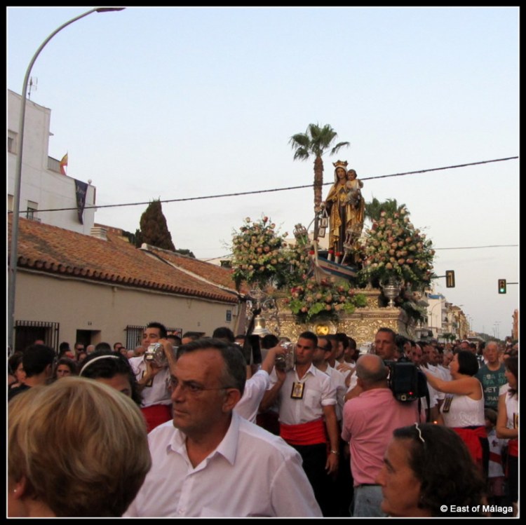 The crowds jostle for position to get the best view