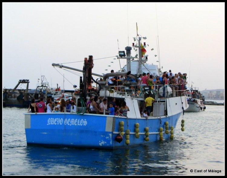 Crowded boats waiting for the Virgen del Carmen to arrive at the harbourside