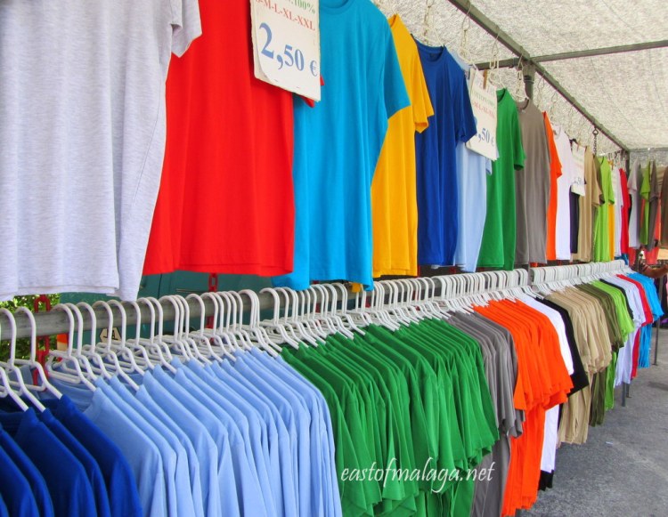 Many coloured tee-shirts on sale at the Spanish market