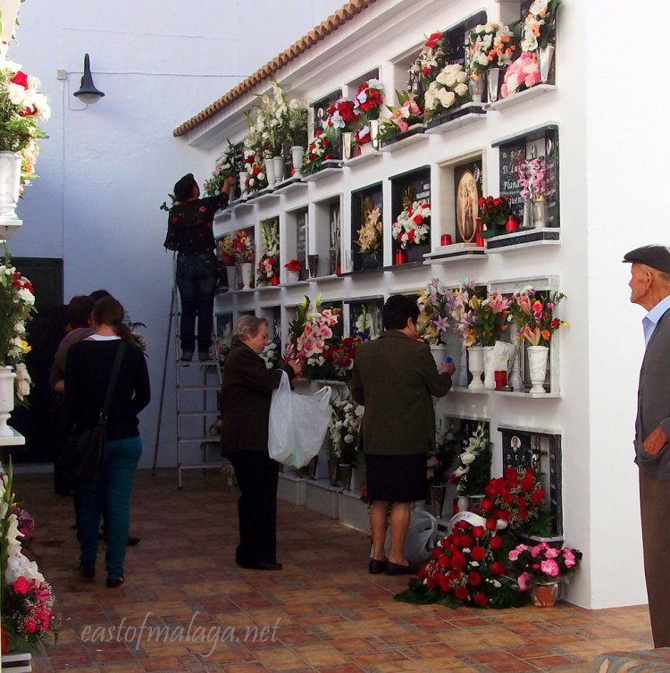 Tending the graves in Competa cemetery for Todos Los Santos