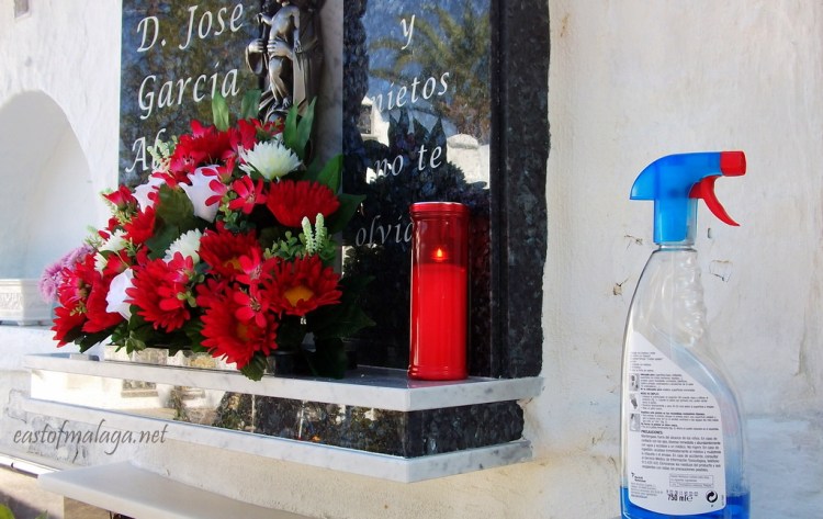Cleaning the gravestones in Competa cemetery, Spain