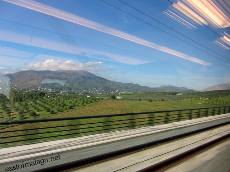 The Spanish countryside flashes by as we travel on the AVE train