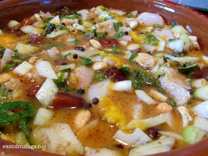 Moroccan chicken marinating in citrus juice mixture