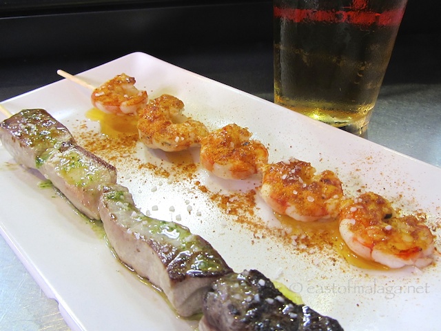 Tapas of skewered tuna and prawns